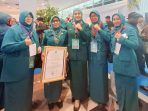 mardiati,-kader-pkk-kota-padang-raih-pin-emas-adhi-bakti-di-puncak-hkg-pkk-ke-53